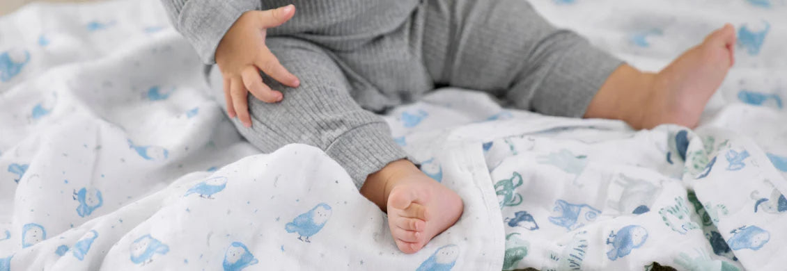 Child Sat on Muslin Blanket
