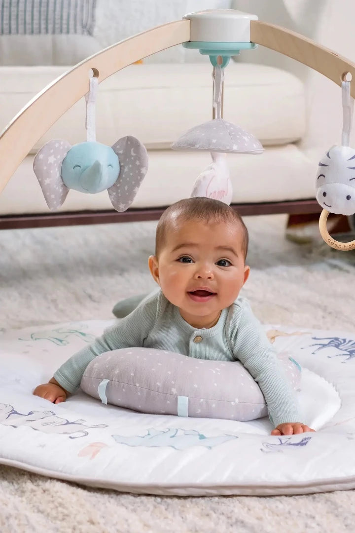 Child on Playmat with Toy Arch