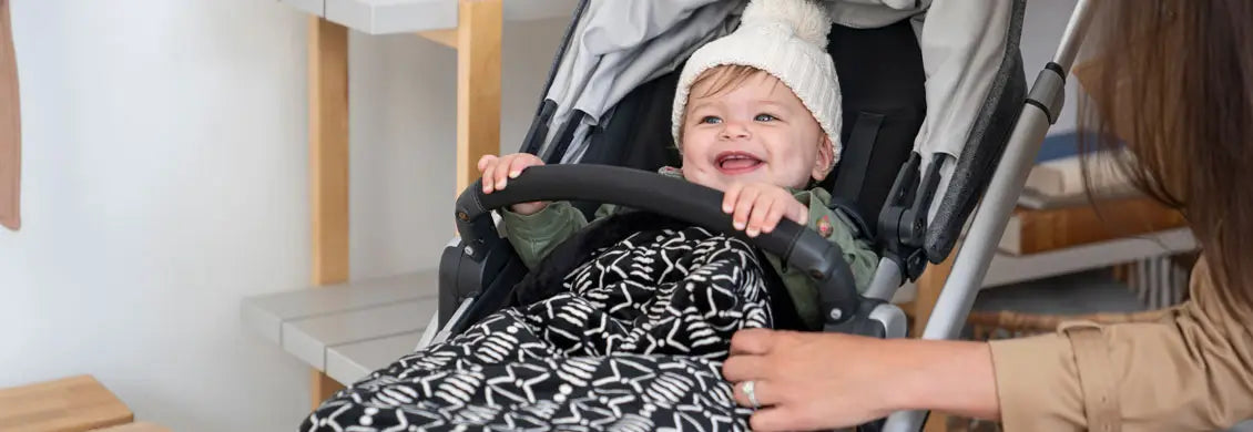 Child Wrapped-up Warm in Stroller 