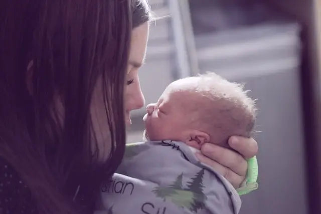 Adult and Newborn Baby