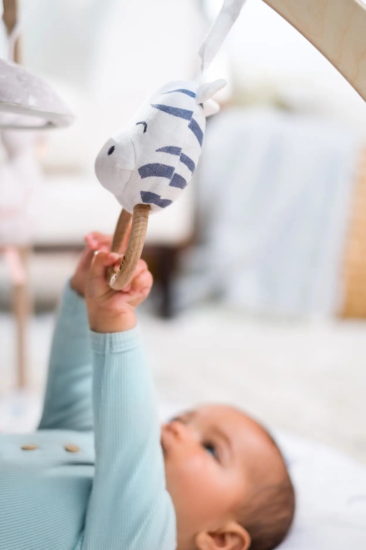 Child Playing with Toy arch